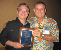 Jim McCaslin '74 receiving the Distinguished Alumni Award from President of the SE Michigan Chapter Frank Krohn '77.